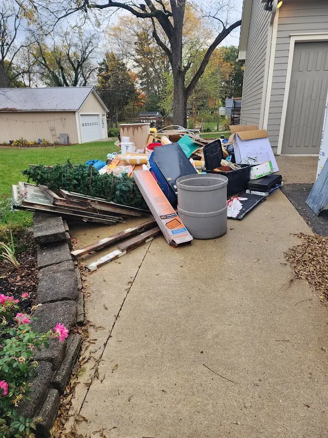 Dumpster being loaded with debris for 3 Yard Dumpster Rental in Southern Shores